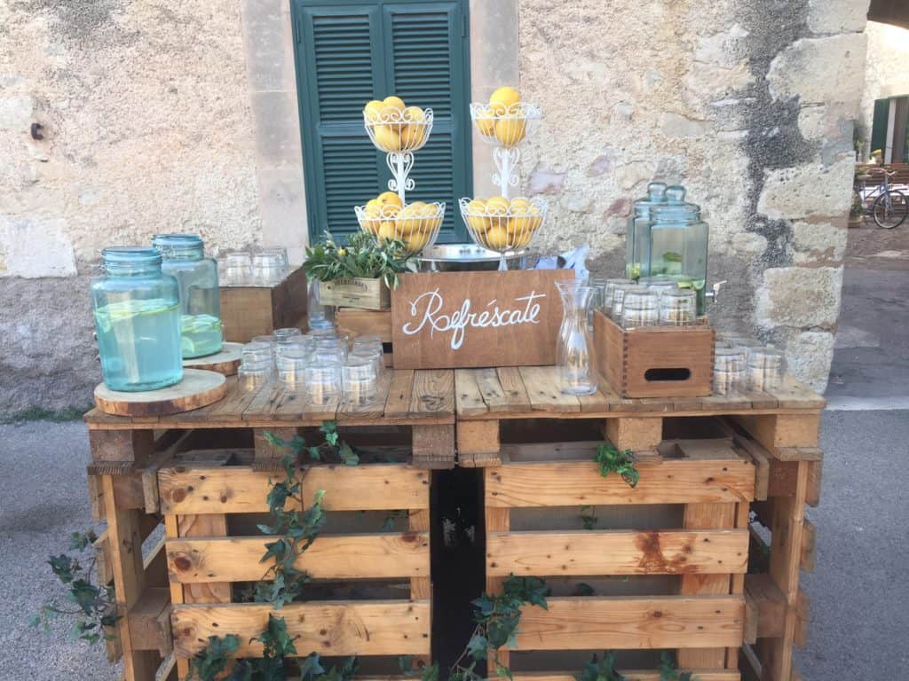 A rustic and refreshing drink stand to welcome your guests to your wedding